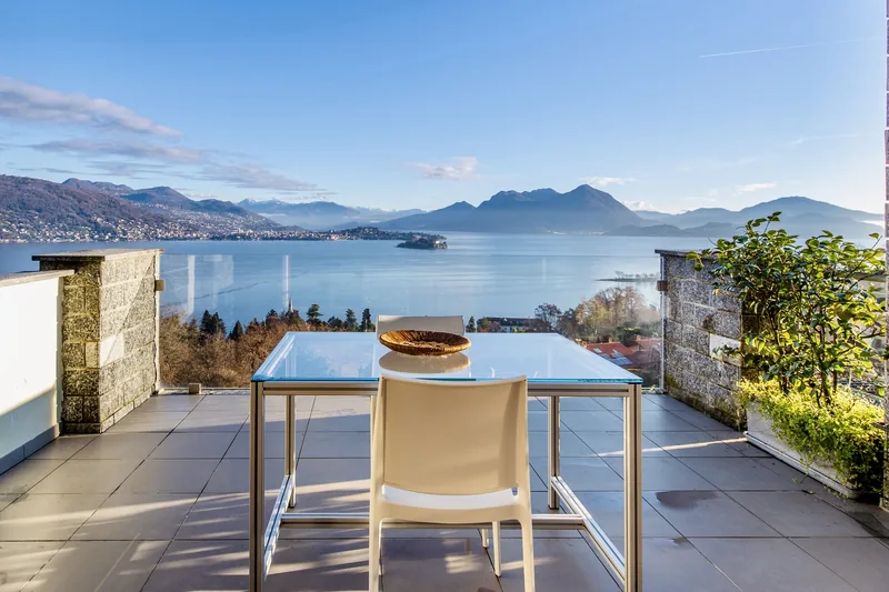 Living room of the Lake Maggiore apartment opening onto a terrace with panoramic lake views