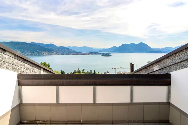 Panoramic view of the lake and mountains from the terrace parapet