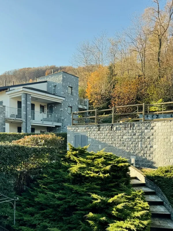 The residence set among trees on the wooded slope above Baveno