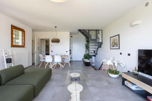 Open-plan living and dining space with the staircase to the upper floors